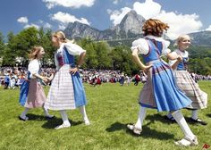 The Arts: In this image we see four swiss girls folk dancing. This is a dance that is usually performed at special events. For example this dance can be performed at festivals and weddings. Folk dancing is usually performed to swiss folk music as well. Switzerland Pictures, Stock Photos People, Bollywood Films, Costumes Around The World, Costume For Kids, Landlocked Country, Festival Inspiration, Cultural Studies, Girls Music