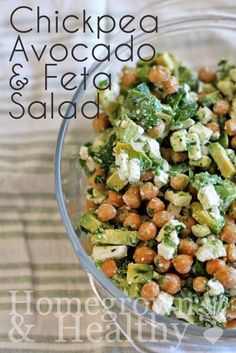 chickpea, avocado and feta salad in a glass bowl on a table