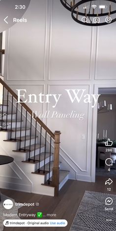 the entry way is full of pannings and features an elegant chandelier