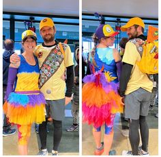 two people dressed up in costumes and hats at an airport, one is hugging the other