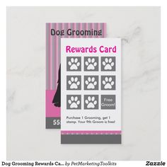 a dog grooming reward card with paw prints on the front and back of it