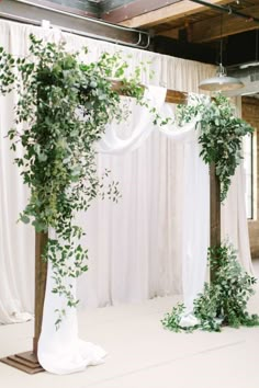 an image of a wedding setup with greenery