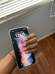 a person holding an iphone in their hand with the screen showing on it's display