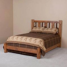 a bed sitting in the middle of a room with a wooden headboard and foot board