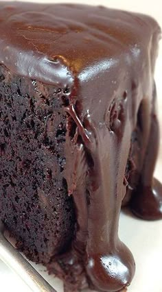 a piece of chocolate cake on a white plate