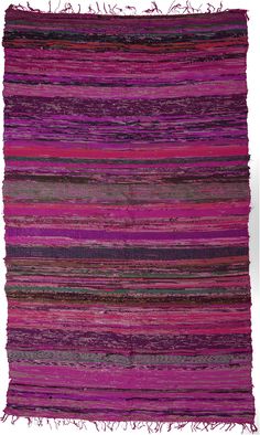 a multicolored rug with fringes on the top and bottom, in different colors