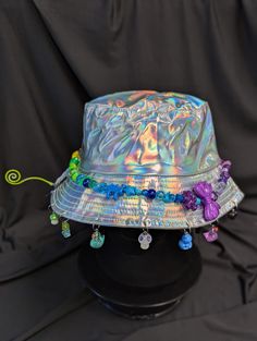 -hat color - silver -bead color - rainbow -charm color - rainbow -unisex adult size -inner circumference - 22.5in -crown dip - 3in -brim - 2.25in -NOT machine washable -Perfect for raves and outdoor festivals! Shipping within the US USPS First Class Package 3-9 days USPS Priority Mail 1-5 days USPS Priority Mail Express 1-3 days Shipping International  USPS First Class Mail International  -Varies- USPS Priority Mail International 6-14 days USPS Priority Mail Express International 3-9 days Shipping times are estimated, NOT GUARENTEED.  +International buyers are responsible for all import fees+ +Orders of $50+ may require signature confirmation upon delivery+ Rainbow Festival, Rainbow Ombre, Kawaii Accessories, Color Rainbow, Doll Stuff, Silver Bead, Bucket Hats, Festival Outfit, Festival Outfits