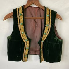 This beautiful green velvet vest was made for a woman due to the darts at the bust; it may have been a costume of some sort. This velvet is sumptuous and truly amazing, and the gold trim is a fun glittery accent! and fun! A phenomenal find! I have 8,000+ antique and vintage French and European textiles in my eBay and Etsy shops! Please visit us at textiletrunk.com and click SHOP for links ~ and please follow us on Instagram! @textiletrunk Luxury Green Women's Vest, Velvet Green Vest, Luxury Green Vest For Work, Luxury Elegant Festive Vest, Cheap Chic Green Vest, Luxury Vintage Festival Vest, Lace Apron, French Workwear, Velvet Vest