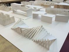 an architectural model is displayed on a table