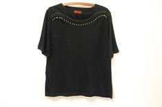 "FREE SHIPPING WORLDWIDE FOR ALL ADDITIONAL ITEMS PURCHASED  -90s vintage black beaded t shirt.  -Soft cotton blend fabric -Lightweight loose fit -Gold beads around neckline to shoulders Brand/Label: Knitworks Estimated Size: M Fabric: Cotton/rayon blend Condition: Excellent vintage Measurements: (taken lying flat) Length: 70cm (27\") Bust: 56cm (22\") Waist: 54cm (21\") Measurements taken while garment is laying flat x2 for full circumference. Check the measurements before purchasing. Your item Slouchy Top, Black Sheer Blouse, Hipster Shirts, Embroidered Tee, Sleeveless Tee, Lovely Tops, Silk Pants, Loose Fitting Tops, Beautiful Skirts