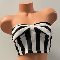 Striped Crop Top Cream/Black With Bow Detail Size Medium 95% Polyester, 5% Spandex Nwt Soft Padded Bust Fitted Striped Strapless Top, Fitted Strapless Striped Top, Fitted Striped Bandeau Top, Striped Fitted Top For Night Out, Fitted Striped Top For Night Out, Chic Black Cotton Tube Top, Fitted Black And White Tops For Day Out, Fitted Black And White Tops For Party, Fitted Black And White Party Tops