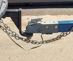 a blue and black tow chain attached to a vehicle