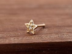 Minimalist 4.5mm Tiny Petite Star Flower with 1mm Clear CZ 14 Karat Yellow Gold Ball End 23 Gauge Nose Stud Ring Piercing Jewelry ▷14K Solid Gold ▷14K Stamped ▷Prong Set ▷Thickness: 23 Gauge | 0.6mm ▷Post Length: Ball 7mm ▷Style: Ball Bone End ▷Gift Box Ring Piercing, Nose Ring Stud, Nose Stud, Star Flower, Piercing Jewelry, Prong Setting, Body Jewelry, Solid Gold, Gift Box