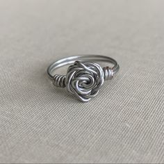 a silver ring sitting on top of a table