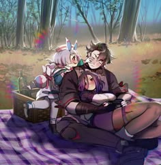 two people are sitting on a blanket in the woods, one is hugging the other