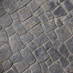 an old cobblestone street with no cars on it