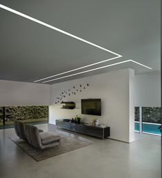 a modern living room with white walls and flooring