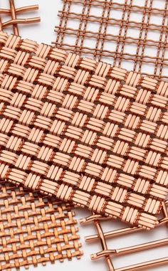 woven material is shown on top of each other in different colors and sizes, including copper