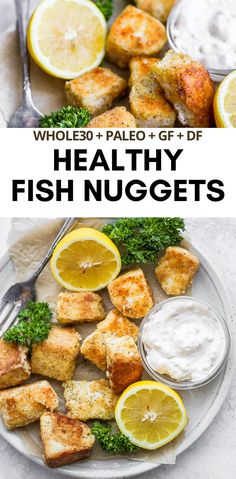 healthy fish nuggets on a plate with lemons and parsley