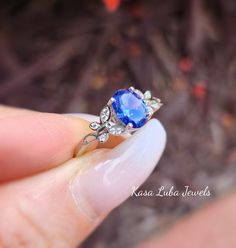 Tanzanite butterfly and Clear Cubic Zirconia SOLID sterling stamped 925 silver Tarnish free sizes 4-10 Top of ring height: 8mm Top of ring width: 6mm Band width: 1.7mm Shank width: 1.7mm Stone material: tanzanite & clear cubic zirconia Center stone size: 8mm x 6mm Stone shape: oval & round Center stone carat weight: 1.2 ct. Total number of CZ stones: 17 Stone setting: prong setting Metal: 925 sterling silver Plating: rhodium plated Finish: high polish simply stunning. High Polished, solid 925 sterling silver. Rhodium plated to prevent tarnishing. TARNISH FREE Rhodium plated to avoid tarnishing Nothing but the best from my custom jewelry store. Email me if you have any questions. Elegant Butterfly Shape Gemstone Rings, Silver Tanzanite Solitaire Jewelry, Elegant Blue Sterling Silver Butterfly Ring, Elegant Butterfly Wedding Ring Stamped 925, Elegant Wedding Butterfly Ring Stamped 925, Elegant Round Butterfly Ring Stamped 925, Ring Butterfly, Vero Beach Fl, Silver Top