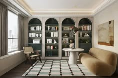 a living room filled with furniture and bookshelves