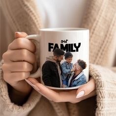 a woman holding a coffee mug with a family photo on the front and side, in her hands