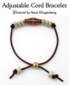 an adjustable cord bracelet with two beads on it