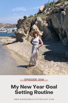 a woman standing on the beach in front of rocks and water with text that reads, my new year goal setting routine