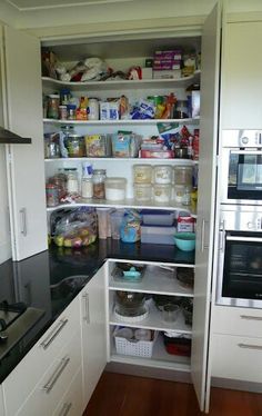 an open pantry with lots of food in it