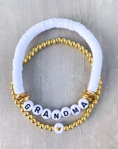 Grandma Beaded Bracelet Stack 💟 Personalize with Nana, Gigi, Nonna, Grammy A sweet little gift for your grandma 💜 CARING TIPS FOR YOUR JEWELRY ⭐️Treat and store with care. ⭐️ For longevity, avoid exposing your jewelry to water. ⭐️ Avoid having direct contact with lotions, perfumes, sanitizers as these chemicals may cause discoloration of your jewelry. Clay Bead Bracelet Ideas Grandma, Grandma Clay Bead Bracelet, Personalized Gold Heishi Beads Bracelets, Adjustable White Charm Bracelet With Colorful Beads, White Charm Bracelet With Colorful Beads, Adjustable White Charm Bracelet With Extender, Nana Bracelet, Grandma Bracelet, Hope Bracelet