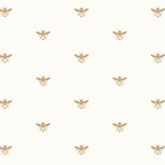 a pattern with gold bees on a white background for wallpaper or wrapping paper,