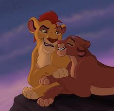 the lion king and his cub are sitting together