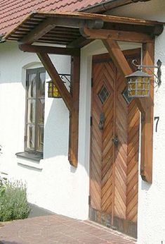 a white house with wooden doors and windows