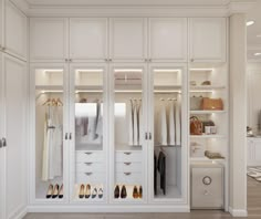 a white closet filled with lots of clothes and shoes