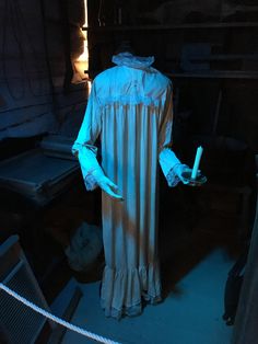 a creepy looking costume is lit up in the dark