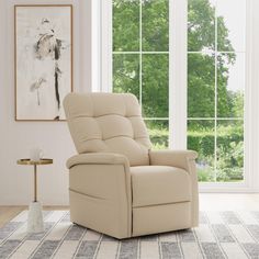 a beige recliner chair sitting in front of a window