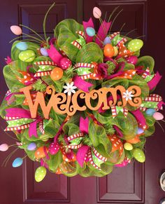 a welcome wreath hanging on the front door