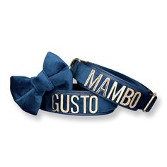 two blue bow ties with the words mamboi and gusto on them in gold lettering