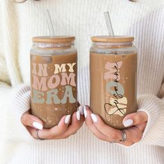 two women holding iced drinks with the words in my mom's bar on them