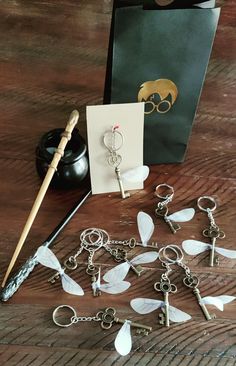 a wooden table topped with lots of key chains