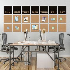 a desk with two computers on it in front of a corkboard wall that says sun moon, fues wedthur fri sat