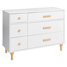 a white dresser with wooden handles and drawers