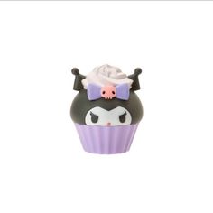 a cupcake with a pink bow on it's head and horns around the top