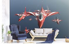 a living room filled with furniture and a red fighter jet wall decal on the wall