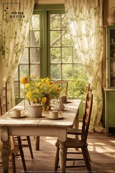 a table with some flowers on it in front of a window