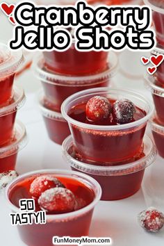 cranberry jello shots in plastic cups on a table