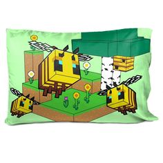 a green pillow with an image of a yellow bird on it's face and some flowers in the background