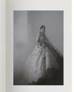 an old photo of a woman in a wedding dress