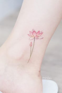 a small pink flower on the ankle with watercolors and ink by uli nim