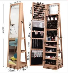 a large wooden jewelry cabinet next to a full length mirror with shelves and drawers on each side